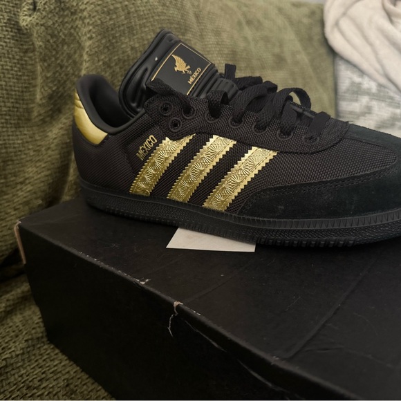 Adidas Black Sneakers with Gold Detail